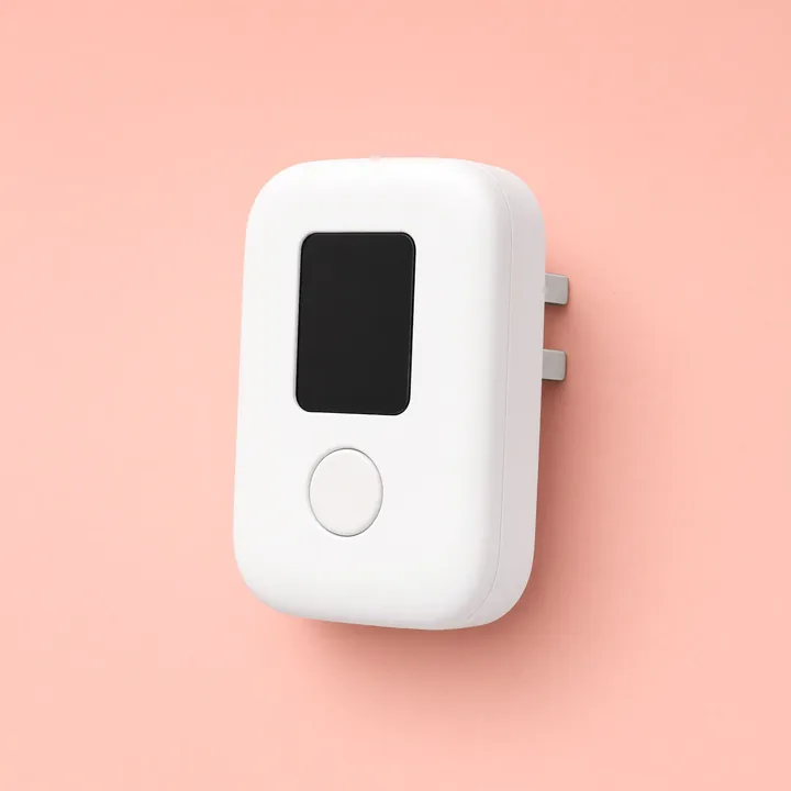 White plug-in carbon monoxide alarm with a small display